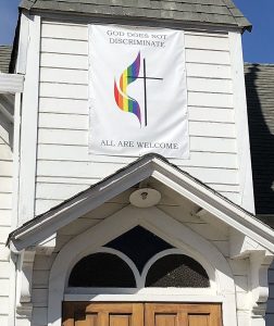 banner over front door of MHUMC says "all are welcome"